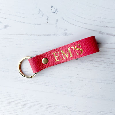 Picture of British-made sustainable coral pink leather keyring with free personalisation, personalised leather gifts UK, coral pink keyring 