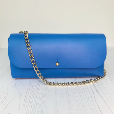Picture of cobalt blue leather crossbody bag, crossbody bag with chain, small leather saddle bag, leather handlebar bag