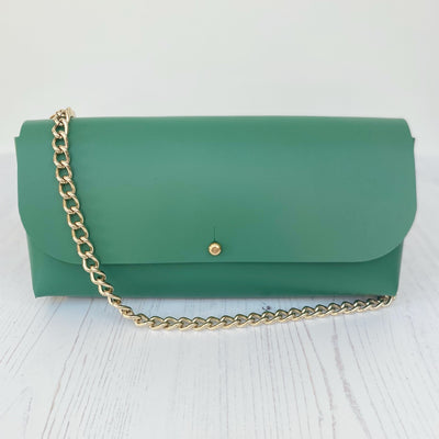 Picture of green leather crossbody bag, crossbody bag with chain, small leather saddle bag, leather handlebar bag