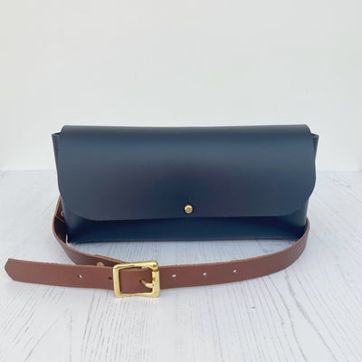 Picture of navy leather crossbody bag, crossbody bag with chain, small leather saddle bag, leather handlebar bag