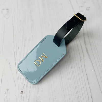 Picture of patent blue personalised leather luggage tag UK