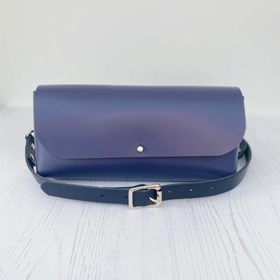 Picture of purple leather crossbody bag, crossbody bag with chain, small leather saddle bag, leather handlebar bag