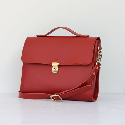 Picture of women's stylish bike bag in the style of a red leather satchel bike bag