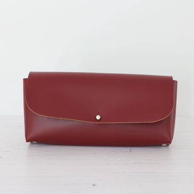 Picture of claret leather crossbody bag, crossbody bag with chain, small leather saddle bag, leather handlebar bag
