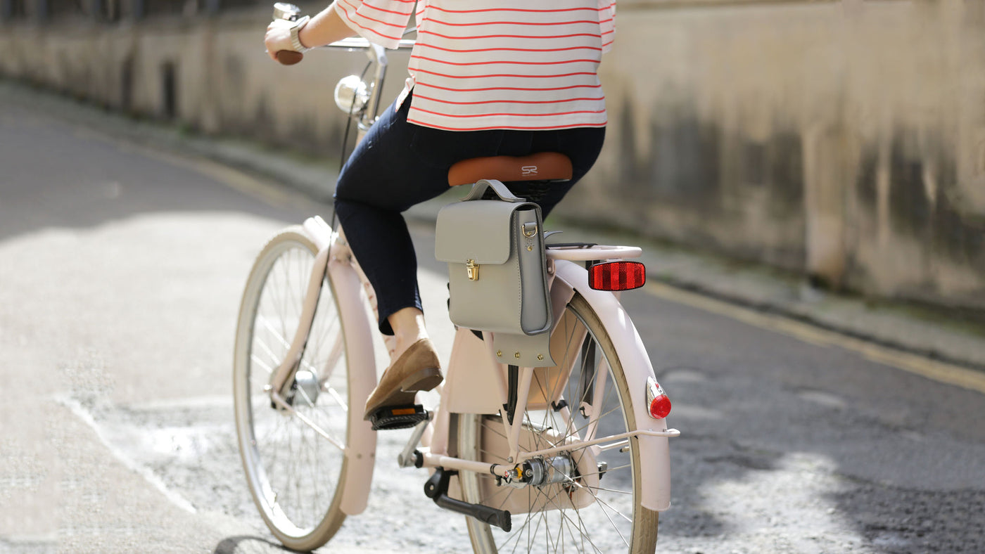 Picture of a women's stylish bike bag in the style of a grey leather satchel bike bag