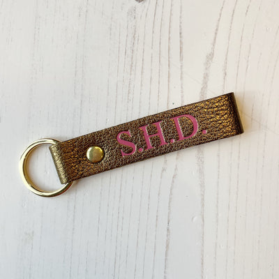 Picture of British-made sustainable bronze leather keyring with free personalisation, personalised leather gifts UK, bronze keyring 