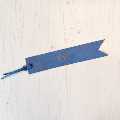 Picture of British-made sustainable cobalt blue leather bookmark with free personalisation, personalised leather gifts UK, cobalt blue bookmark 