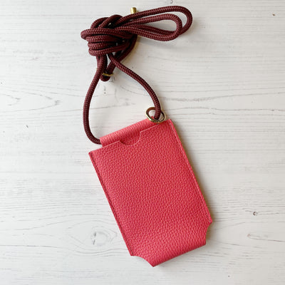 Picture of coral pink personalised leather phone bag , women's crossbody phone bag UK, personalised phone bags UK