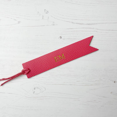 Picture of British-made sustainable coral pink leather bookmark with free personalisation, personalised leather gifts UK, coral pink bookmark 