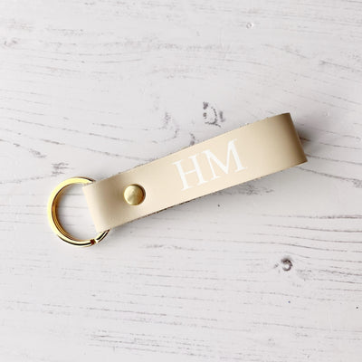 Picture of British-made sustainable smooth cream leather keyring with free personalisation, personalised leather gifts UK, smooth cream keyring 
