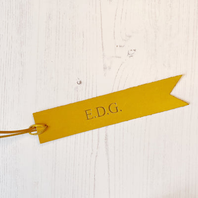 Picture of British-made sustainable yellow leather bookmark with free personalisation, personalised leather gifts UK, yellow bookmark 