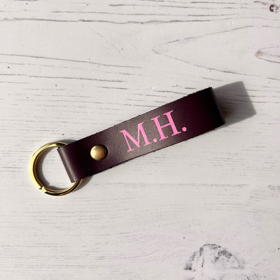 Picture of British-made sustainable purple leather keyring with free personalisation, personalised leather gifts UK, purple keyring 
