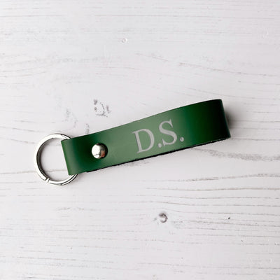 Picture of British-made sustainable racing green leather keyring with free personalisation, personalised leather gifts UK, racing green keyring 