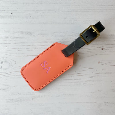 Picture of salmon pink leather luggage tag, personalised luggage tag UK, personalised British leather luggage tag.
