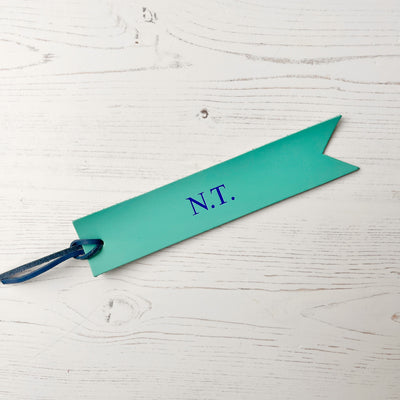 Picture of British-made sustainable aqua blue leather bookmark with free personalisation, personalised leather gifts UK, aqua blue bookmark 