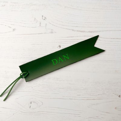 Picture of British-made sustainable racing green leather bookmark with free personalisation, personalised leather gifts UK, racing green bookmark 