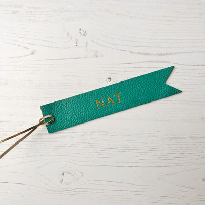 Picture of British-made sustainable teal leather bookmark with free personalisation, personalised leather gifts UK, teal bookmark 