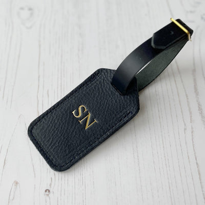Picture of navy personalised leather luggage tag UK