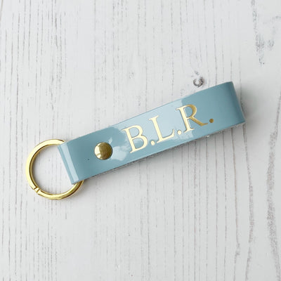 Picture of British-made sustainable patent blue leather keyring with free personalisation - UK leather accessories