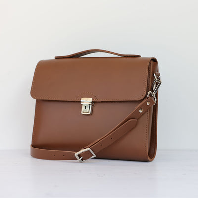 Picture of women's stylish bike bag in the style of a brown leather satchel bike bag