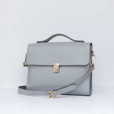 Picture of women's stylish bike bag in the style of a grey leather satchel bike bag