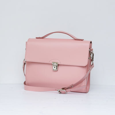 Picture of women's stylish bike bag in the style of a pink leather satchel bike bag