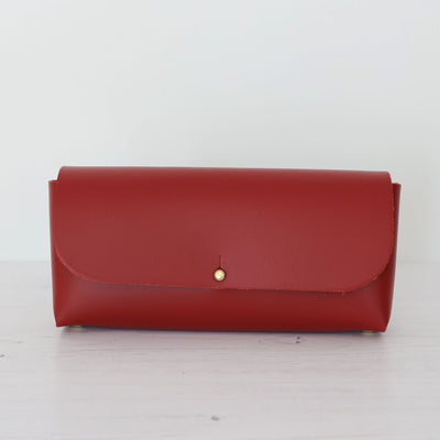 Picture of red leather crossbody bag, crossbody bag with chain, small leather saddle bag, leather handlebar bag